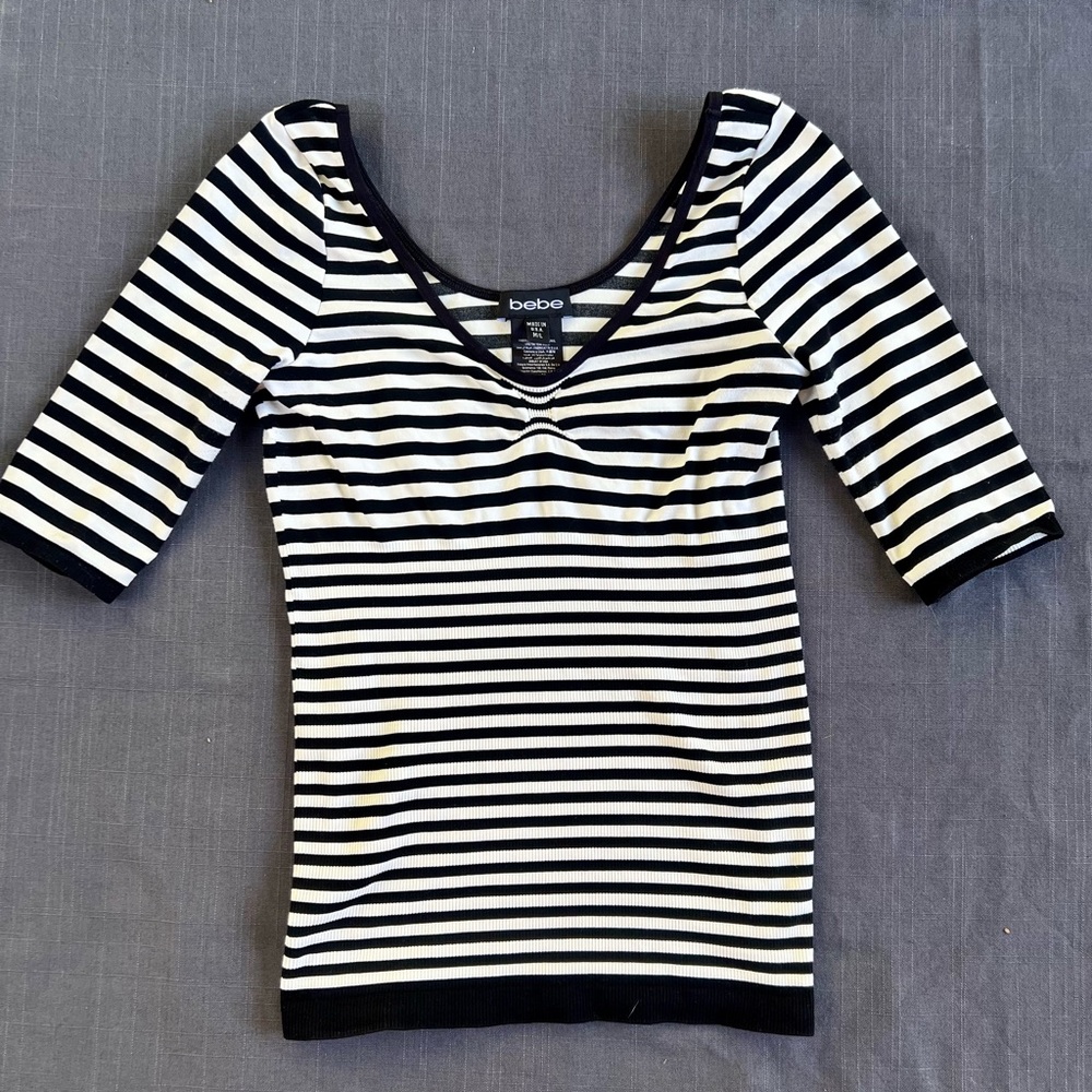 Bebe black and white striped M/L top.